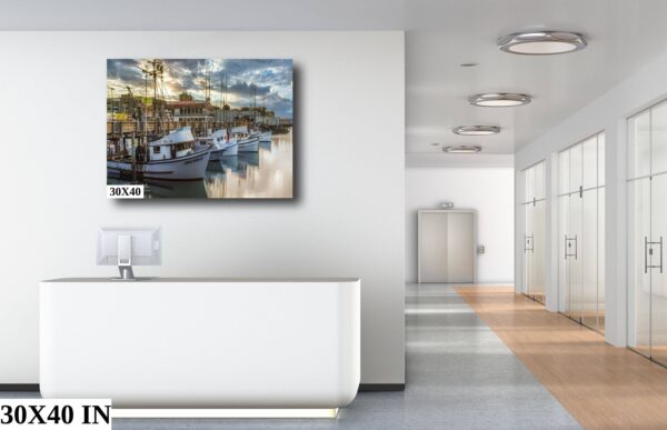 A painting of boats in the water on a wall.