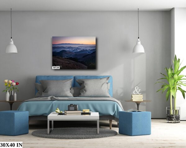 A bedroom with a bed and two blue ottomans