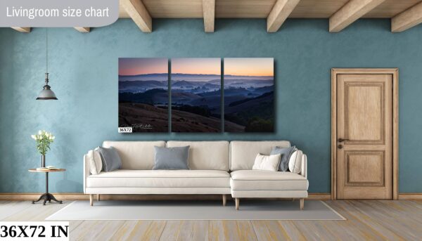 A living room with a couch and a wall hanging