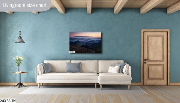 A living room with a couch and a painting on the wall