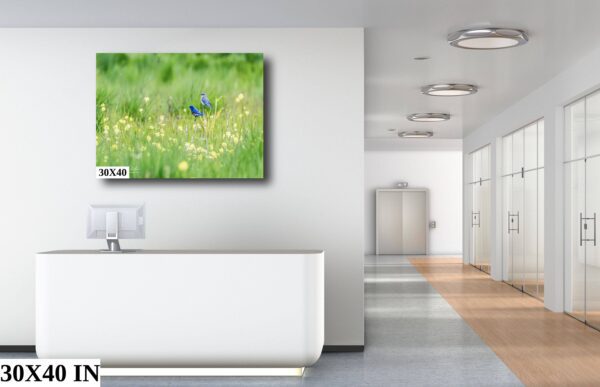 A white bathroom with a large painting on the wall