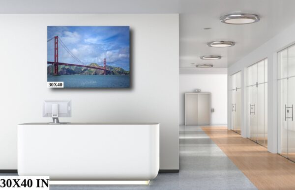 A white room with a large painting of the golden gate bridge.