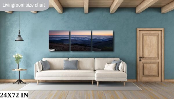 A living room with a couch and a wall hanging