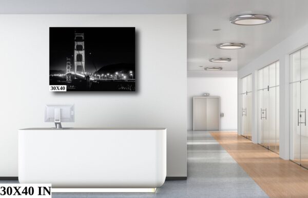 A white room with a large picture of the golden gate bridge.