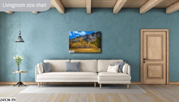 A living room with a couch and a painting on the wall