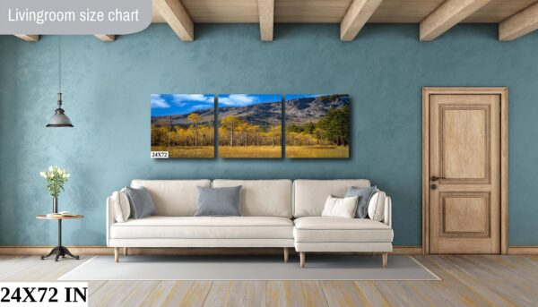 A living room with a couch and a wall hanging