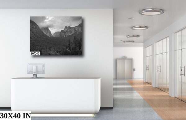 A black and white photo of mountains in the background.