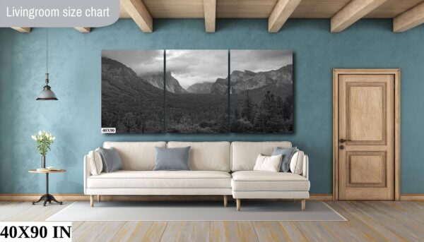 A living room with a couch and a wall hanging