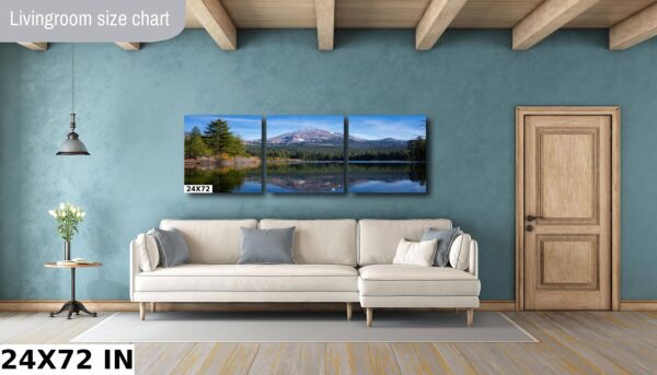 A living room with a couch and a wall hanging