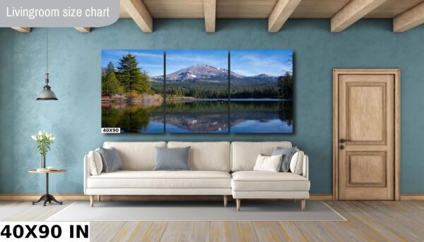 A living room with a couch and a large mirror
