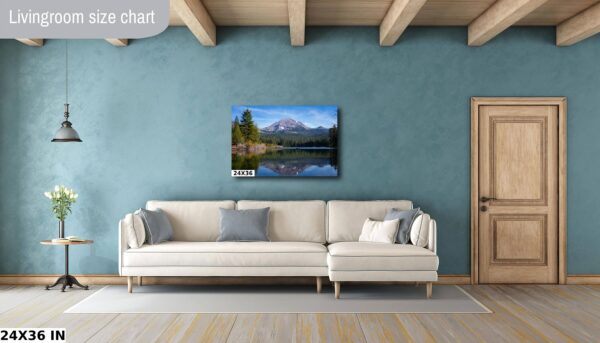 A living room with a couch and a painting on the wall
