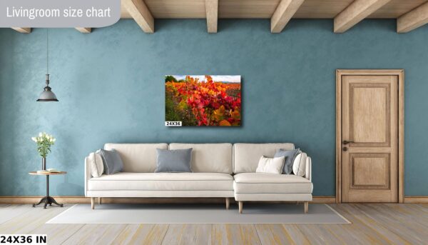 A living room with a couch and a painting on the wall