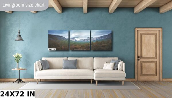 A living room with a couch and a wall hanging