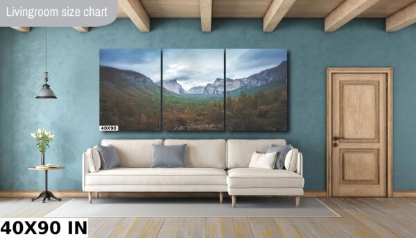 A living room with a couch and three paintings