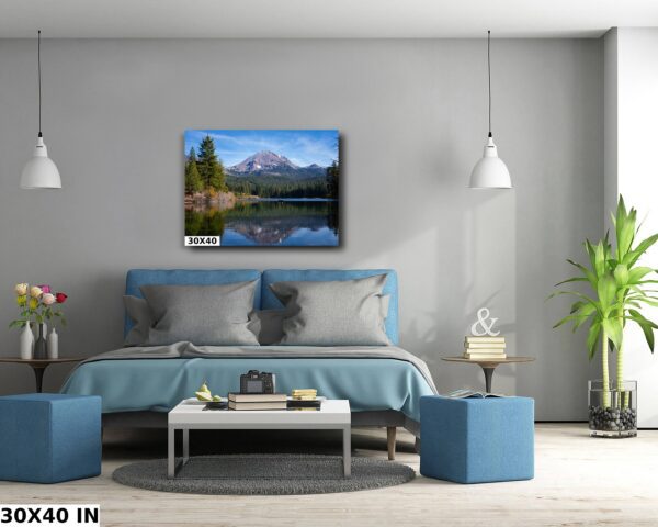 A bedroom with a bed and two tables