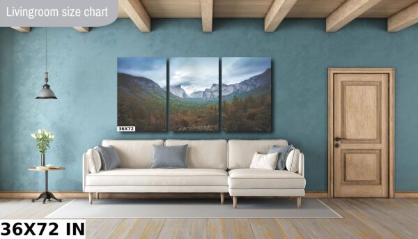 A living room with a couch and a wall hanging