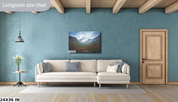 A living room with a couch and a painting on the wall