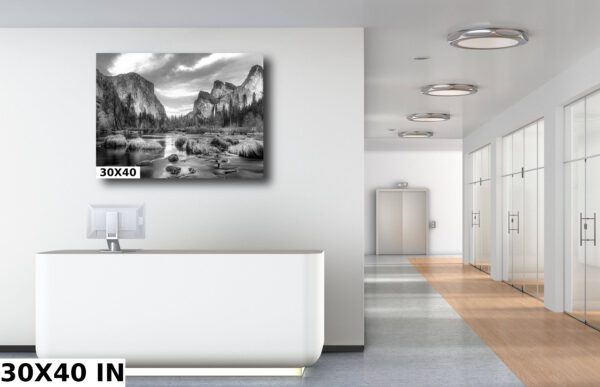 A black and white photo of mountains in the background.