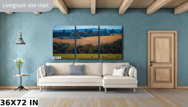 A living room with a couch and a painting on the wall