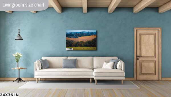 A living room with a couch and a painting on the wall