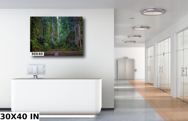 A large painting of trees in the middle of a room.