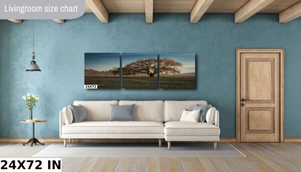A living room with a couch and wall art