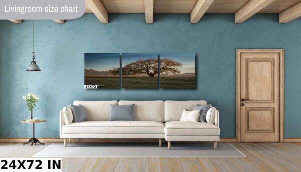 A living room with a couch and wall art