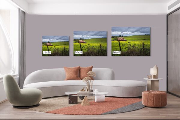 A living room with three pictures on the wall