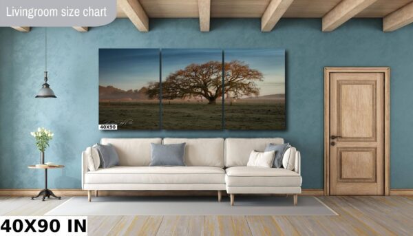 A large tree in the middle of a field.