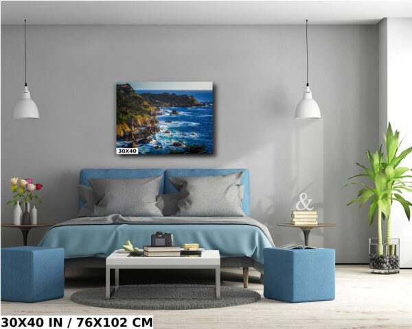 A painting of the ocean and cliffs in a living room.