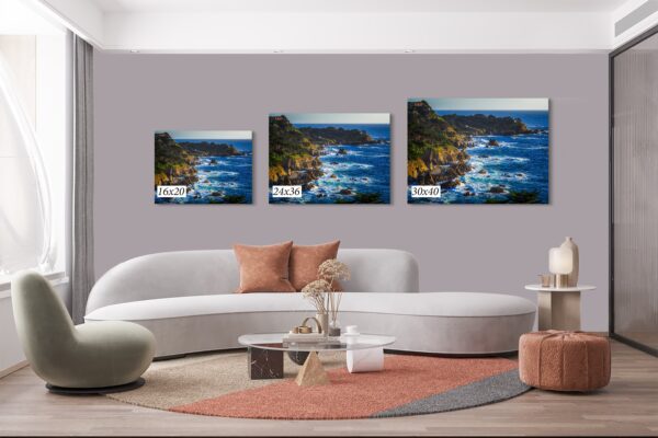 A living room with three paintings on the wall