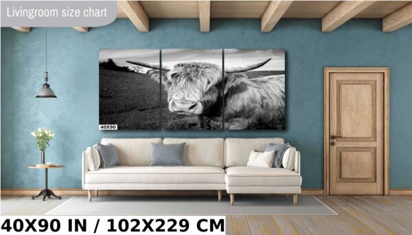 A cow is standing in the middle of a room.