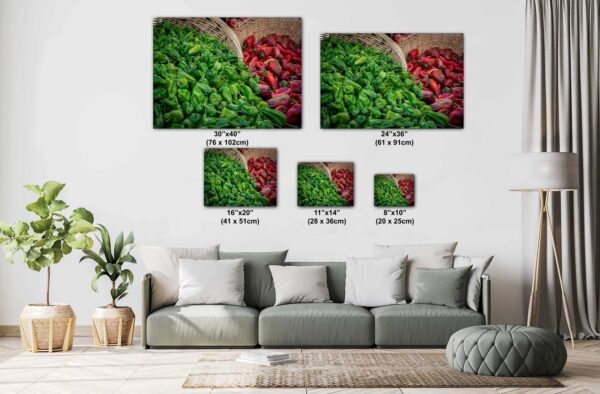 A couch with pillows and a picture of vegetables