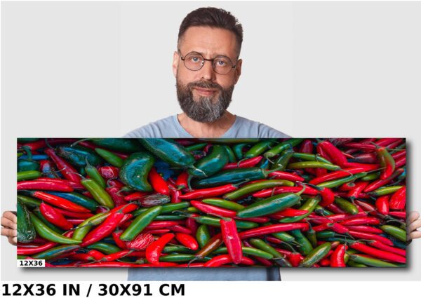 A man is standing in front of a picture