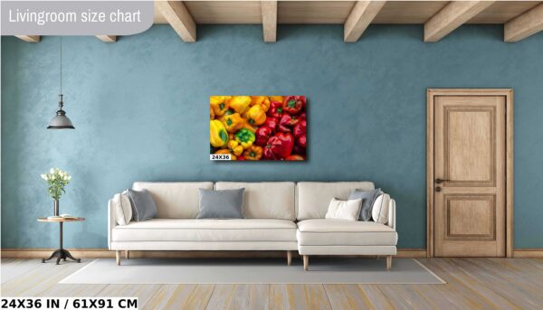 A living room with a couch and a painting of peppers