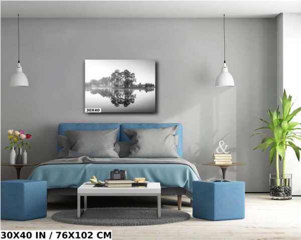 A bedroom with blue walls and a large bed.