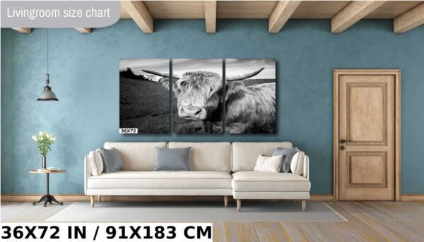 A cow is standing in the middle of a room.