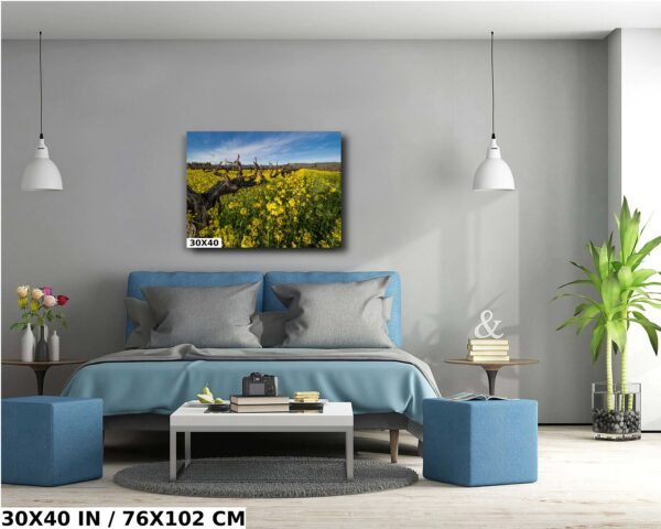 A bedroom with a blue bed and a yellow field