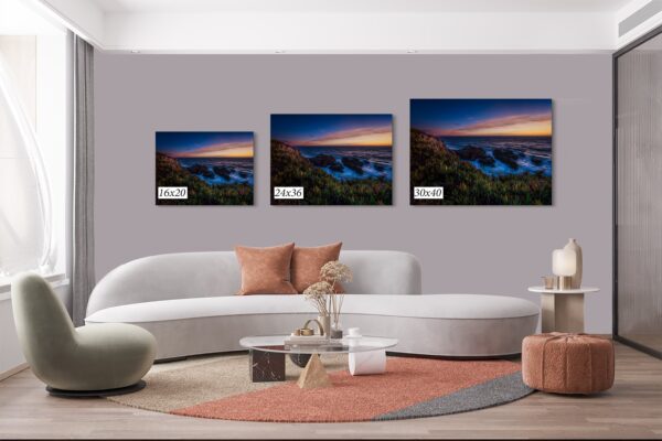 A living room with three different sizes of pictures
