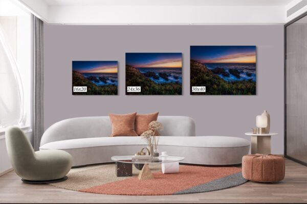 A living room with three different sizes of pictures