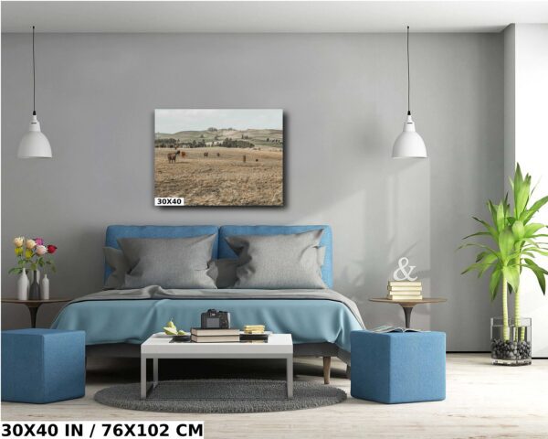 A bedroom with a blue bed and gray walls