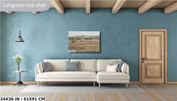 A living room with a couch and a painting
