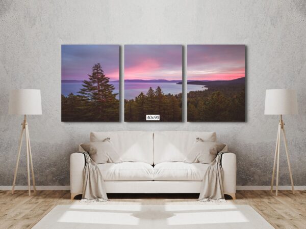 A living room with a couch and three pictures on the wall