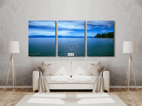 A living room with a couch and three pictures on the wall