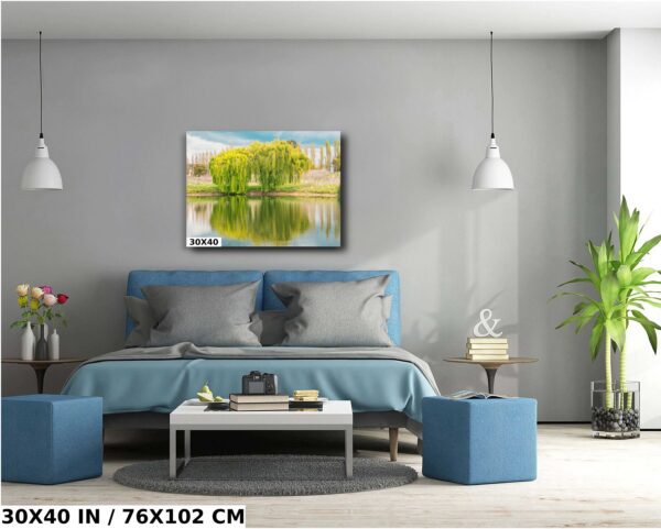 A bedroom with a bed and two blue ottomans