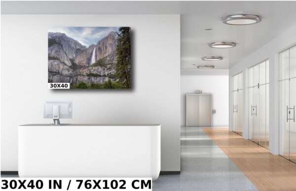 A large picture of the mountains in front of a white wall