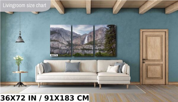 A living room with a couch and a wall hanging