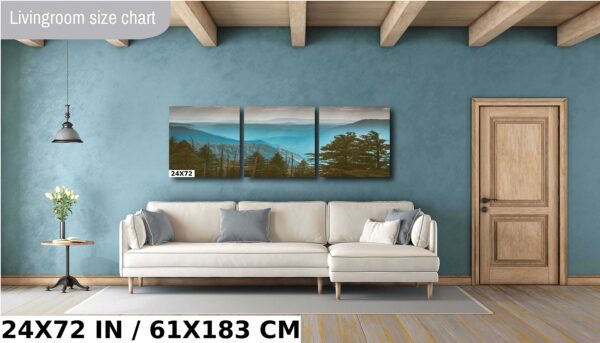 A living room with a couch and a wall hanging