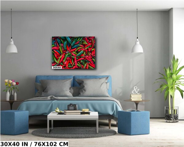 A painting of red peppers on the wall