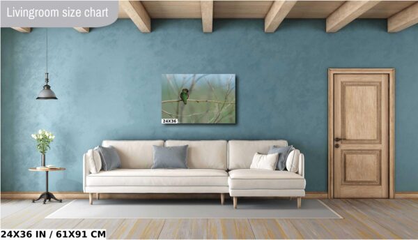 A living room with a couch and a painting on the wall